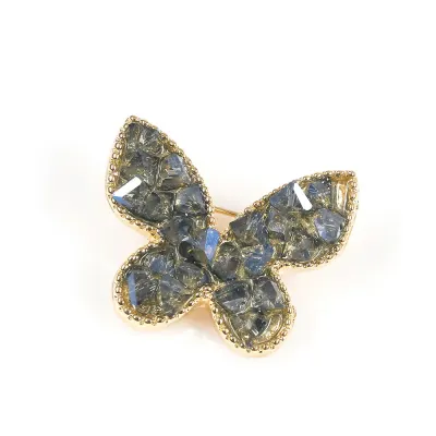 Brosa martisor fluture cu pietre albastre si detalii aurii