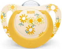 Suzeta din silicon Nuk - Star, peste 18 luni, galbena cu flori