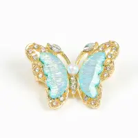 Brosa martisor fluture auriu cu aripi bleu