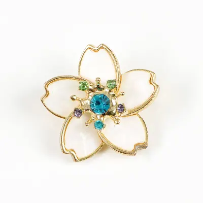 Brosa martisor floare alba cu pietre bleu