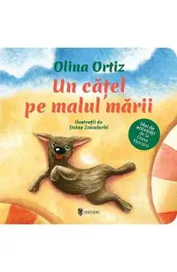Un catel pe malul marii