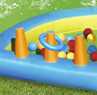 Saltea gonflabila Happy Hop Oasis 7 in 1, loc de joaca cu bile, tun cu apa, spatiu de catarat, doua tobogane, 30 bile plastic incluse