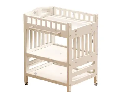 Masa de infasat pentru bebelusi Nichiduta Deluxe White, cu Salteluta si Lavoar incluse, suporturi laterale de depozitare, design multifuncional, inaltime reglabila, 4 roti pivotante 360