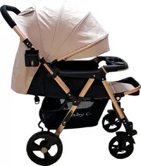 Carucior pentru copii Baby Care PRO 511 Crem, Cadru aluminiu, Maner reversibil, Spatar reglabil 5 trepte, Amortizoare, Frana picior