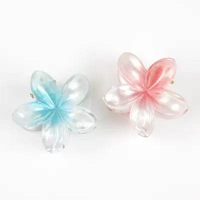 Set 2 clesti de par in forma de floare roz si albastra