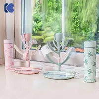 Suport pentru uscat biberoane KikkaBoo Tulip Grey,capacitate pana la 8 biberoane,din plastic nontoxic fara BPA