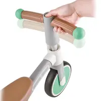 Tricicleta copii de echilibru Hape cu 3 roti verde deschis, cadru usor de aluminiu, scaun reglabil, roti fabricate din material spumant TPU moale si flexibil de la 18 luni