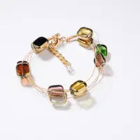 Bratara delicata cu elemente multicolore si metalice pe fire fine aurii