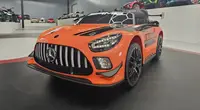 Masinuta electrica pentru copii Mercedes GT3 AMG Portocaliu, 12V, licenta oficiala, telecomanda 2.4G, scaun piele, deschidere usi