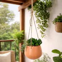 Plantă artificială suspendată cu mix de suculente, în ghiveci ceramic portocaliu 16 cm, cu agățătoare din sfoară