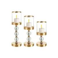 Set 3 sfesnice pentru lumanari, tip felinar, dimensiuni diferite, sticla, auriu/transparent