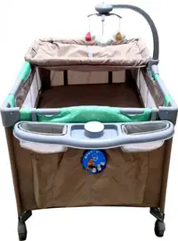 Patut copii Baby Care PRO FMAT Maro, Pliabil, 2 Niveluri de inaltime, Melodii, Masa infasat, Carusel cu jucarii din plus, Plasa insecte